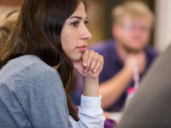 woman listening to speaker